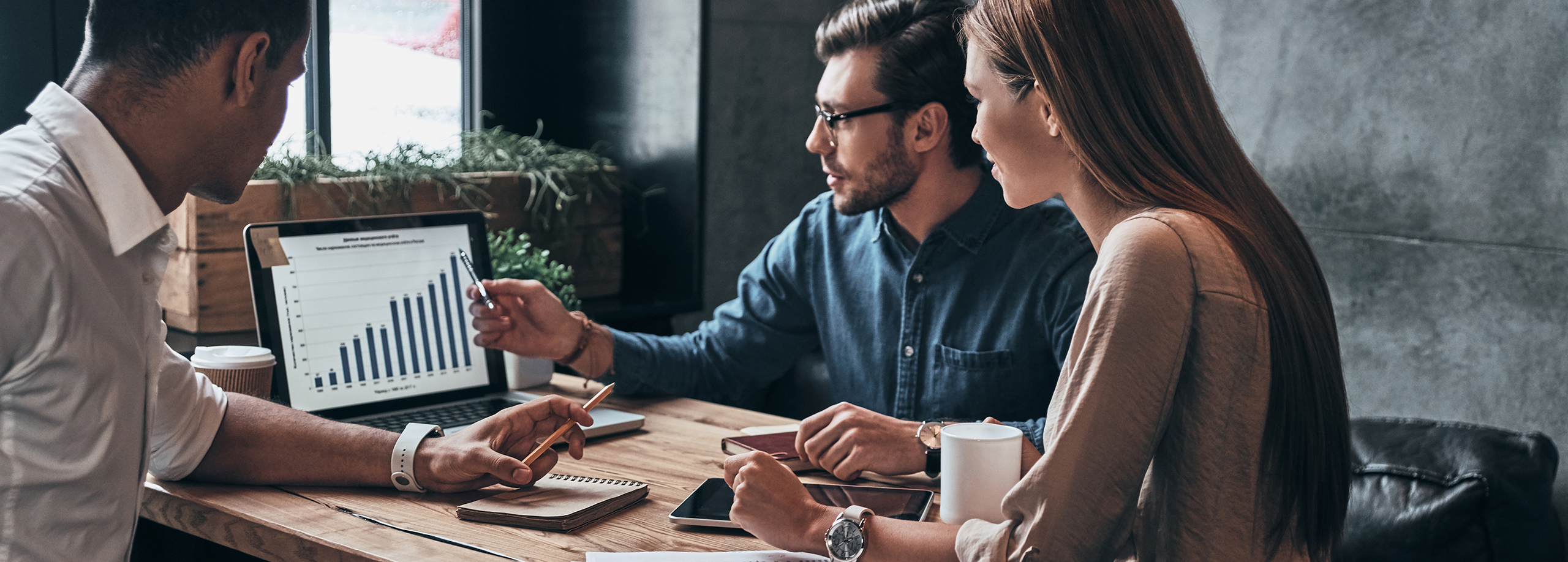 Three people in a meeting